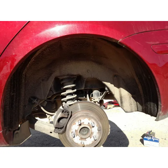 Plastico Pase Rueda Tras. Izq. para Toyota Avensis (_T25_)